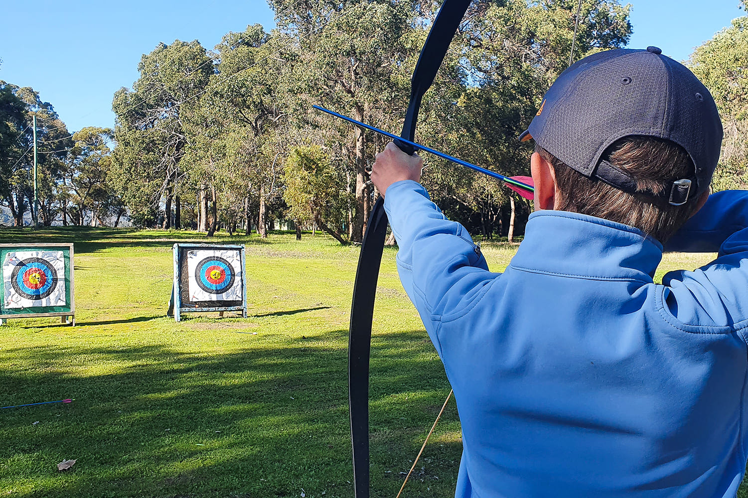 Camp Fairbridge - Archery on an open field
